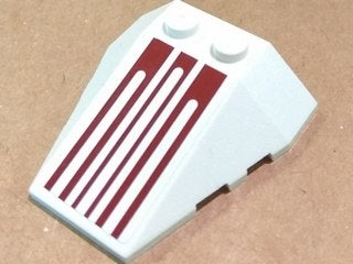 White LEGO 4x4 wedge triple brick with stud notches and a dark red six-pinstripe pattern on the top surface.