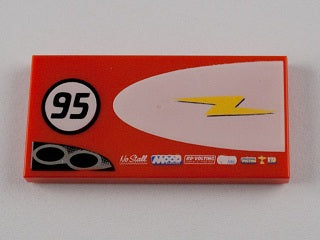 Red LEGO 2x4 tile with '95' in a black circle, a yellow lightning bolt on a white half-ellipse, and small sponsor logos.