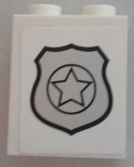White LEGO 1x2x2 panel brick with side supports and hollow studs, featuring a silver police badge design with a star.