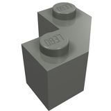 Grey LEGO 87620 modified facet 2x2 brick. It's an L-shaped piece with two studs, each embossed with the LEGO logo.