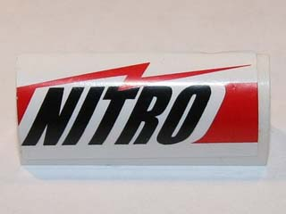 LEGO white curved slope 1 x 4 x 1 1/3 brick with a red and white 'NITRO' sticker featuring a lightning bolt.