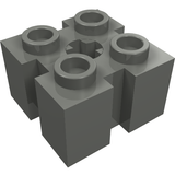 Dark gray LEGO 90258 Brick, Modified 2 x 2 with four studs, side channels, and a central star-shaped axle hole.