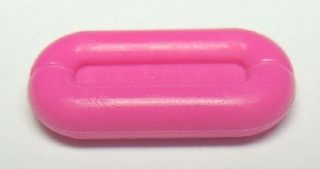 A bright pink LEGO 92355a Friends Accessories Sponge. The small, oval piece has raised edges resembling an inflatable raft.