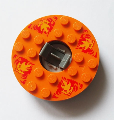 LEGO 92549c05pb01 Ninjago Spinner turntable. Orange round base with bright light orange faces on red flames pattern.