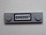 Light gray LEGO 1x4 modified plate with 2 studs and a black sticker featuring 'GH60007' in white text.