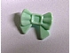 Light green LEGO Friends bow hair decoration with a small pin, seen from the front on a white background.
