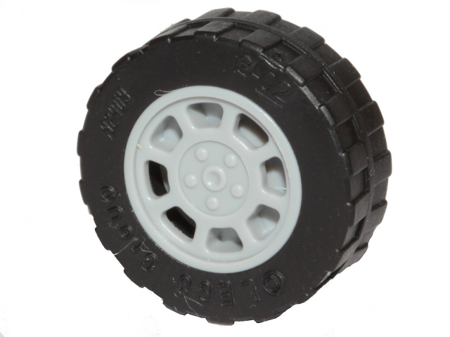 LEGO black tire, 17.5mm D. x 6mm, with shallow staggered treads and a light grey 8-spoke wheel hub.