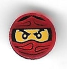 Close-up of a round red LEGO 1x1 tile featuring the Ninjago Trapped Kai pattern with yellow eyes and black mask.