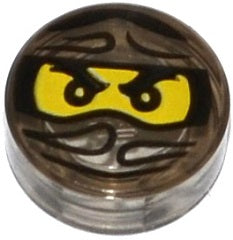 Round, translucent dark gray LEGO 1x1 tile with a Ninjago Trapped Cole pattern: yellow eyes and black ninja mask.