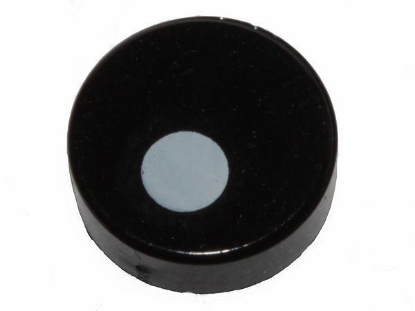 LEGO 98138pb097 black round 1x1 tile with a small, slightly offset white circle on its surface.