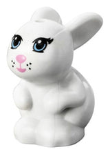 LEGO Friends style white bunny figure sitting, with bright light blue eyes, bright pink nose/mouth, and black whisker dots.