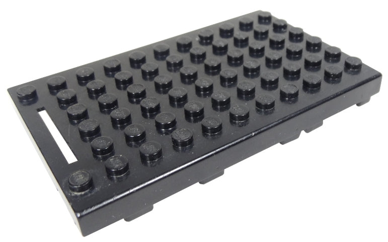 Black LEGO bb0044c Electric 4.5V Battery Box, 6x11 Type III, with studs and a white slot on the left.