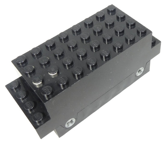 A black LEGO 9V electric motor, part bb0129, 4x10x3 1/3, with visible studs and two light grey axle holes on its side.