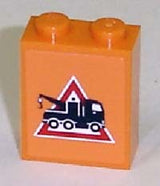 Orange LEGO 1x2x2 brick with a white-bordered red triangle danger sign pattern, showing a black tow truck with a hook.