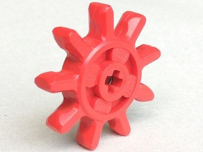 Red LEGO Technic Expert Builder 9-tooth gear, featuring a cross-shaped axle hole in its center.