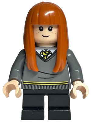 LEGO Minifigure Susan Bones with orange hair, freckles, a gray Hufflepuff sweater, and black short legs.