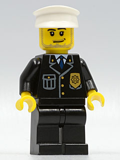LEGO Minifigure cty0099 with black suit, blue tie, gold badge, white hat, smirk, and stubble beard.