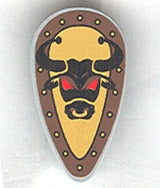 LEGO minifigure oval shield with a black bull head and red eyes on a yellow field, surrounded by a brown studded border.