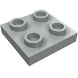 Light grey LEGO 8 Plate, Modified 2 x 2 with four studs visible on top.