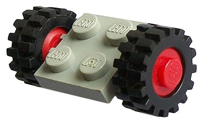 LEGO light grey 2x2 plate with two black wheels, red hubs, and offset tread tires on a white background.