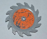 Gray LEGO Technic circular saw blade with an orange center, gray splatter, white scratches, and a central pin hole.