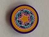 Round LEGO 2x2 tile with a yellow star, teal floral stained-glass pattern, and purple rim on a yellow background.