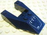 Dark blue LEGO 6x4 cutout wedge brick with stud notches, featuring a silver circuitry pattern sticker, on a light tan baseplate.