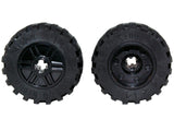 Two black LEGO wheels (part 55982c05 / 92402) with 18mm diameter, axle hole, fake bolts, shallow spokes, and offset tread.