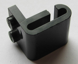 Angled view of a black LEGO x461 Modified 1 x 2 Plate with Steam Engine Cylinder and round surfaces.